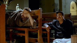 പ്രാഞ്ചിയേട്ടൻ & The Saint háttérkép