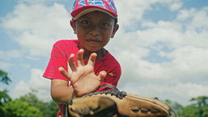 A Million Smiles: The Story of Baseball Without Borders háttérkép